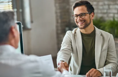 happy-male-candidate-handshaking-with-manager-after-successful-job-interview-office